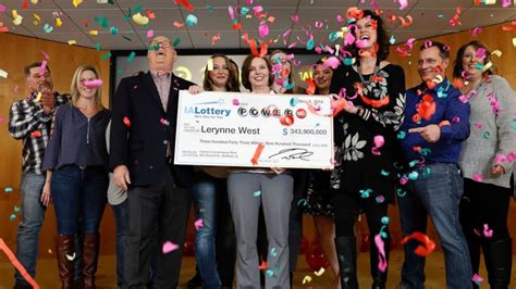 Iowa Powerball winner claims $343.9 million check .